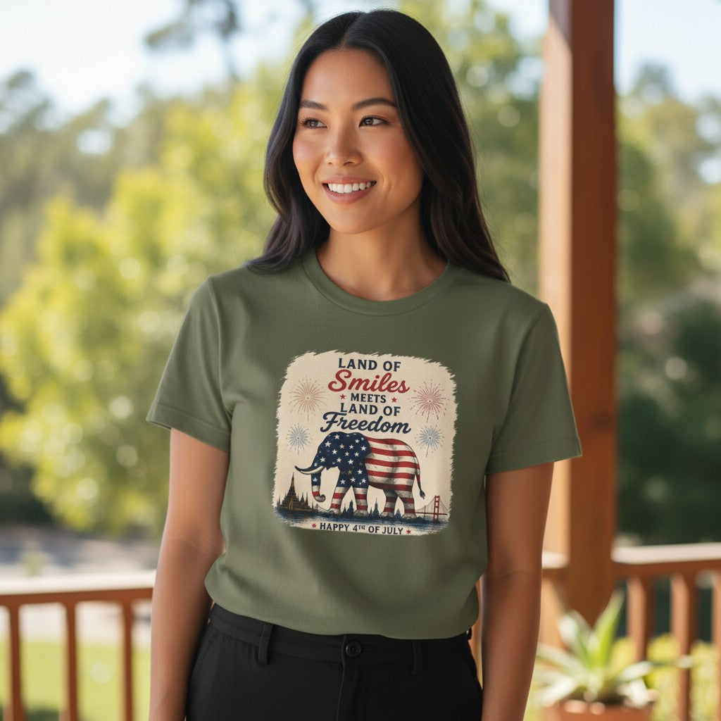 THAILISH.SHOP olive green 100% ring-spun cotton unisex tee with elephant draped in US flag, fireworks, and skyline graphic.