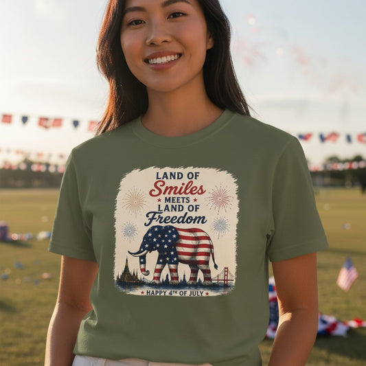 THAILISH.SHOP olive green 100% cotton unisex tee with "Land of Smiles Meets Land of Freedom" graphic featuring an elephant in the US flag.