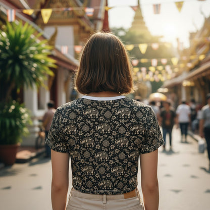 THAILISH.SHOP Thai Chang Crop Tee with all-over elephant and floral print on black polyester fabric.